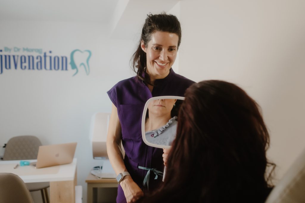 Aesthetics clinic showing patient results post-treatment in mirror