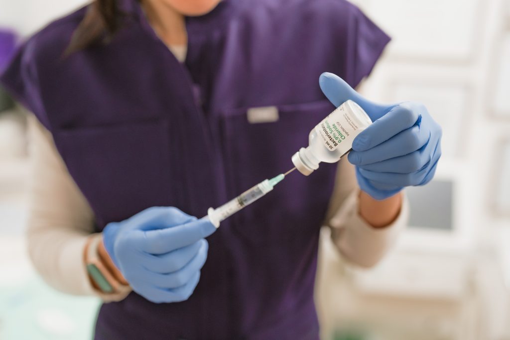 Drawing up saline for administration of treatments